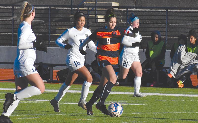 Habersham Central’s Anna LaBarbera gets past Dacula defenders Tuesday night.