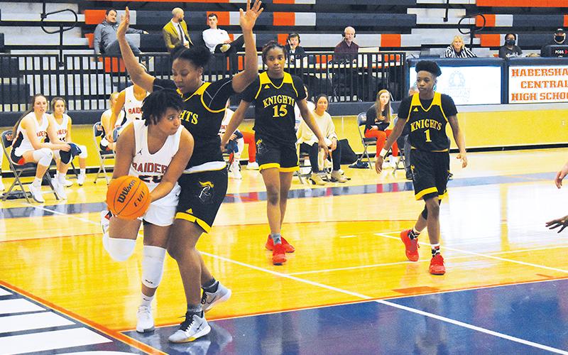 Habersham Central’s Nykerriah Brown works around a zone defense during Friday night’s win over Central Gwinnett.