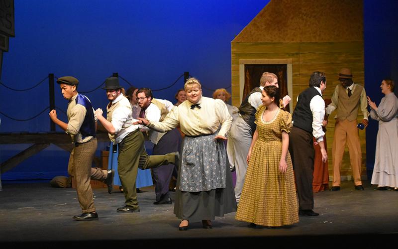 The Carousel cast works on a dance number at rehearsal.