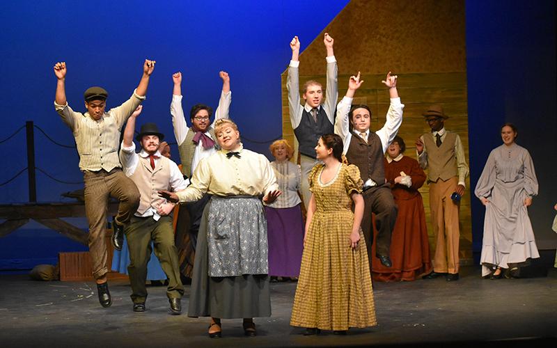 A group shot of the Carousel cast from rehearsal this week is shown.