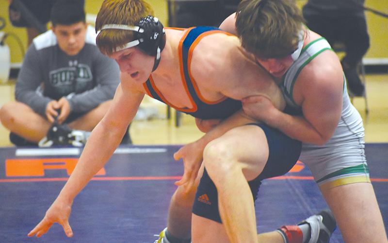 Habersham Central’s Colby Watson (left) begins his escape against Buford’s Aaron Riner.