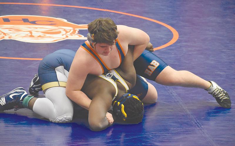 Habersham Central’s Dalton King locks up Dacula’s Giovanni Ganthier during the regional tournament on Saturday morning.