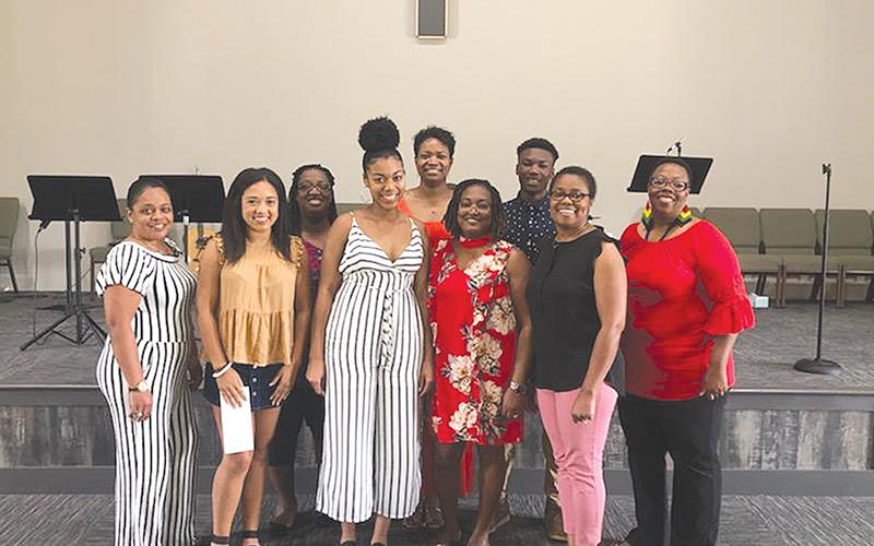 The 2019 ceremony to give out the Reading Divas Scholarship included (front row from left) Monique Rucker, Nevaja Brown (scholarship recipient), Naya Williams (scholarship recipient), Lisa Teasley, Kerri Davis and Pam Brock. Back row are Tara Young, Talara Deshazer and Ahmad Teasley (scholarship recipient).