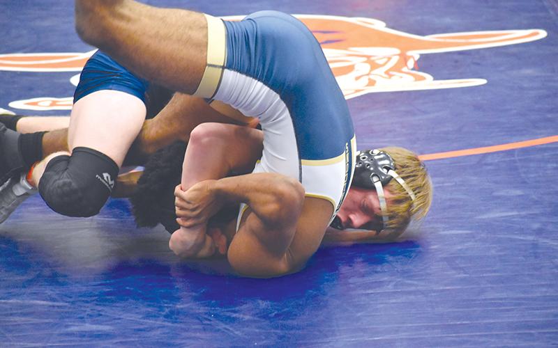 Habersham Central’s Eli Pilgrim pins his opponent during the consolation semifinals of Saturday’s regional meet.