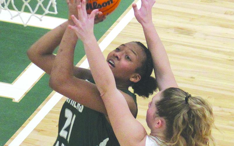 The Lady Indians’ Abby Carlan defends Athens Academy’s India Sheats under the hoop. ANDY DIFFENDIRFER/Clayton Tribune