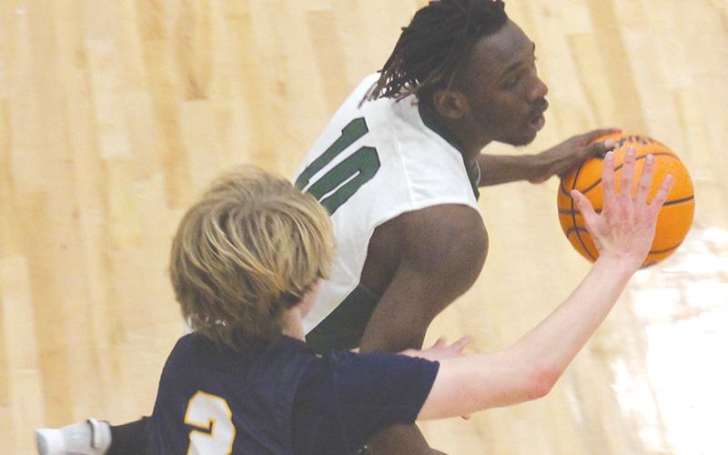 allulah Falls’ Simeon Respress looks for an open teammate with Galloway’s Quinton Alterman defending.