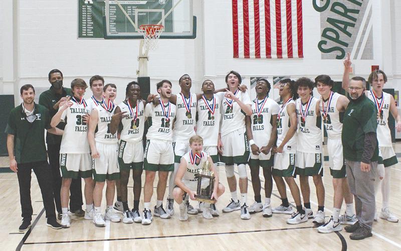Tallulah Falls captured its first region championship in program history Wednesday night, beating George Walton 64-47. Pictured are (front) Kale Corbett, (back from left) head coach Cody Coleman, assistant coach Lowell Hamilton, Colton Hicks, George Ketch, Lincoln Hall, Simeon Respress, David Rodriguez, Anfernee Hanna, Sammy Davis, Gabe Keene, Devonte Allen, Julian Gober, Diego Crotta, Bryan Cope, assistant coach Matt Crotta and Charlie Cody.