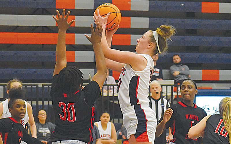 Habersham Central’s Taylor Wade looks to score inside against Winder-Barrow on Tuesday night.