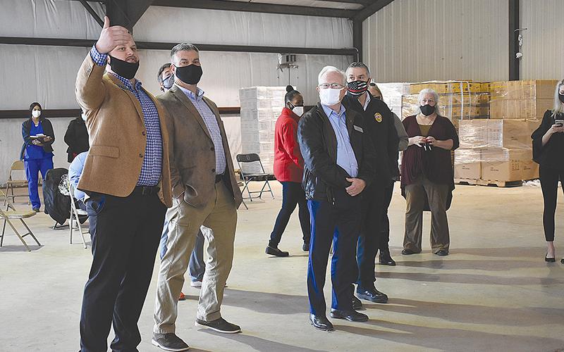 Sen. Bo Hatchett (left) talks with Rep. Victor Anderson, County Manager Phil Sutton and Emergency Services Director Chad Black at the mass vaccination site in Clarkesville on Friday afternoon.