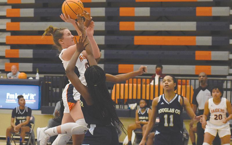 Habersham Centra's Taylor Wade drives hard to the hoop against Douglas County. CODY ROGERS/Staff