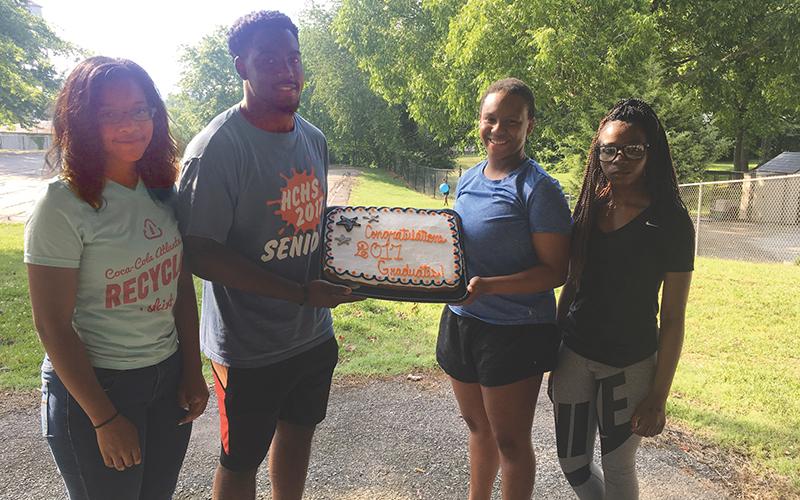 Former Habersham students (from left) Traci Hodges, Michael Babers, Mikaela Hudson and Julianna Teasley celebrate their graduation four years ago. The students are among many that Tammy Teasley (below photo with husband Anthony) has helped advise over many years of being a helpful hand for youth in her community.