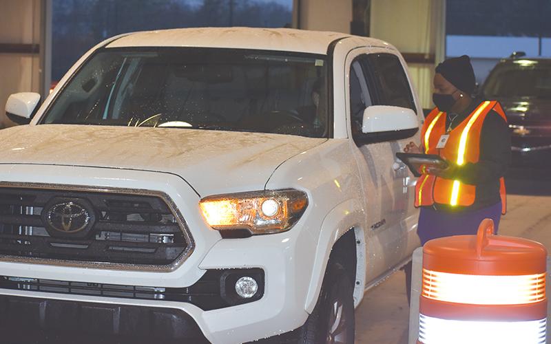 The first car gets checked in at the Habersham County mass vaccination site Monday morning in Clarkesville.