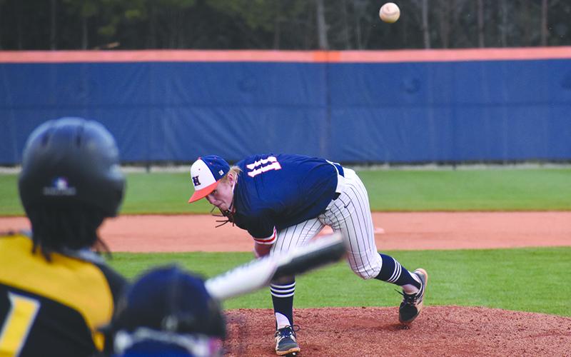 Austin Jones (11) delivers a pitch to Central Gwinnett’s Justin Johnson during a recent home game. In game one against Buford, Jones held the Wolves’ bats at bay to keep the Raiders in the game heading into the sixth inning.