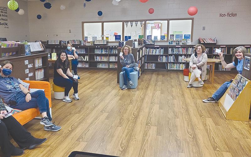Clarkesville Elementary staff members LaDonna Canup, Lauren Fair, Brenda Falck, Allison Boykin, Tara Brookshire and Marie Benfield show off their vaccination cards. HABERSHAM COUNTY SCHOOLS/Submitted