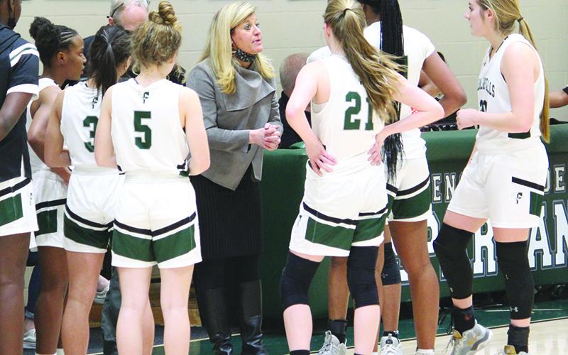 Coach Brandy Corbett talks to her Tallulah Falls team during a game this season.