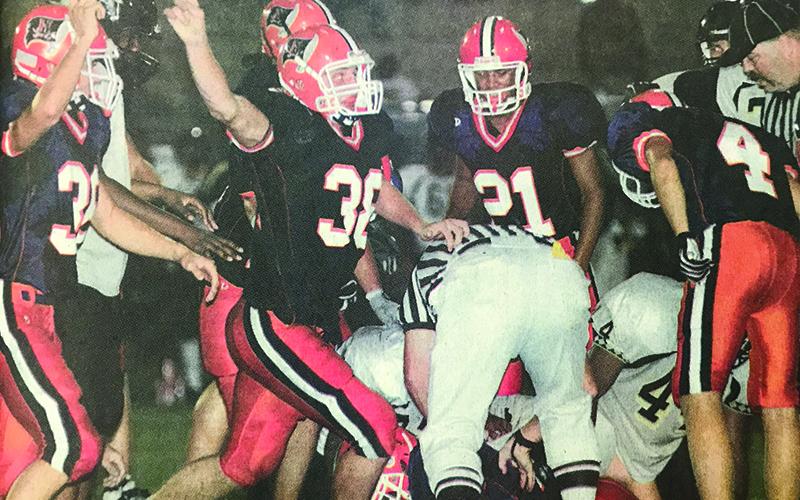 Habersham Central’s Marty Patterson (38) celebrates along with teammates after a big stop during a 2006 game.