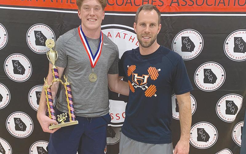 Habersham Central’s Pierce Vickery won a state title in weightlifting with the guidance of coach Tip Johnson.