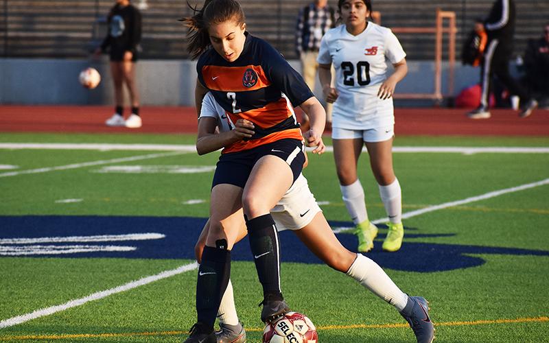 Habersham Central’s Ryalie Acker battles for position against a defender during a home game earlier this season against Winder-Barrow.