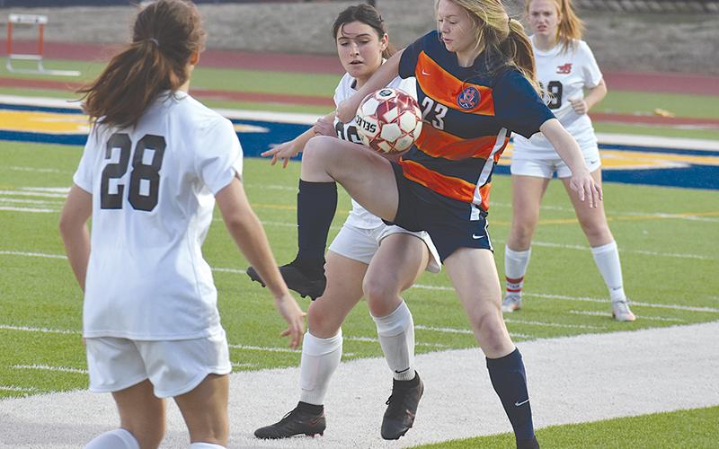 Habersham Central’s Sarah Clark juggles the ball to gain possession during Tuesday’s win over Winder-Barrow.