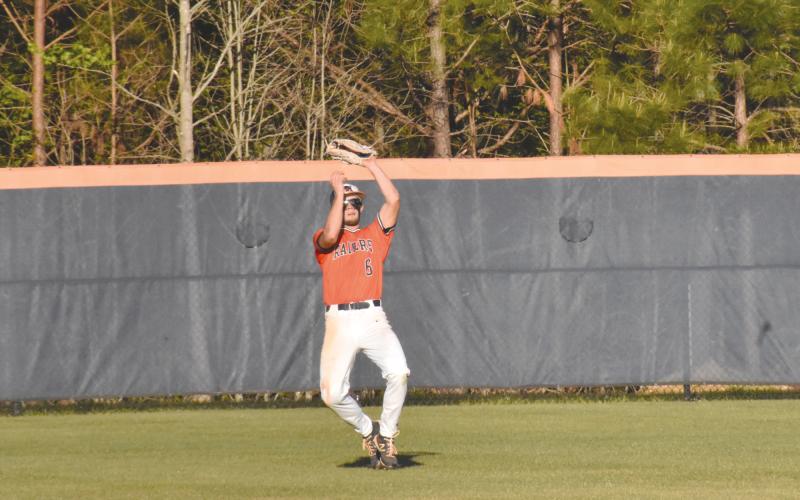 Azzi Cervantes makes a catch in center field during the Raider’s last home game against Lanier. Cervantes had two RBI for HCHS Wednesday night. ISAIAH SMITH/Staff
