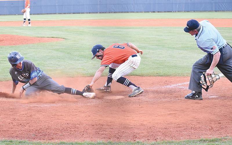 Habersham Central’s Azzi Cervantes puts down a tag on an Elbert County runner looking to score on a wild pitch in the  Raiders 11-3 loss to Elbert County on Monday night.