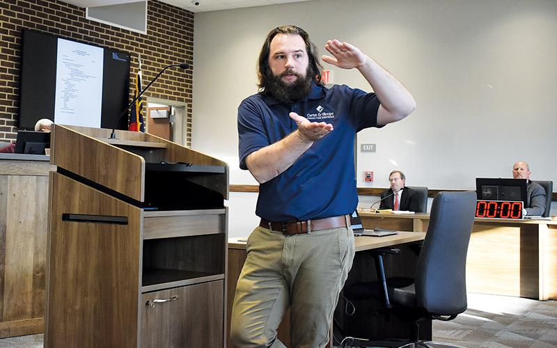 Carter &amp; Sloope Grant Writer Gabe Morris explains more details about the 2021 Community Development Block Grant (CDBG) program during a preliminary hearing on Tuesday.