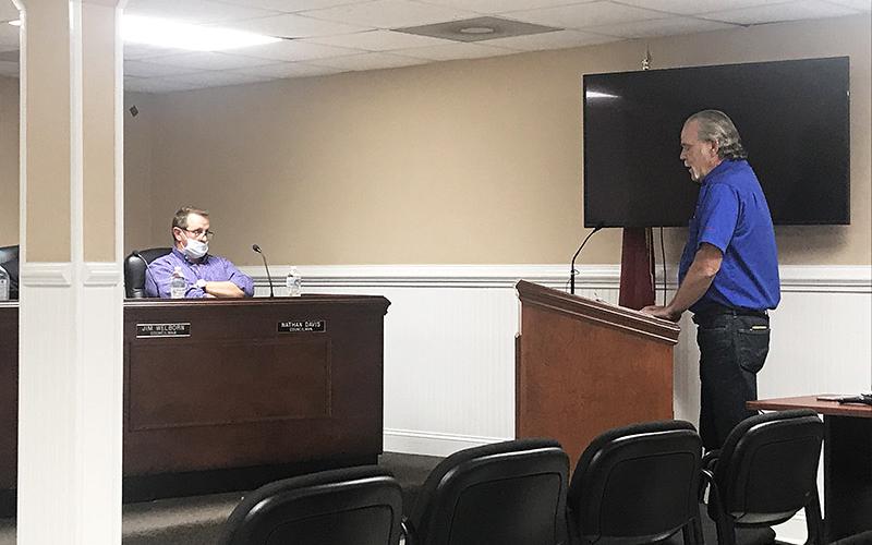 Chuck Miller, vice president for the Marion Body Works fire truck dealer for the state of Georgia, makes a presentation at Tuesday’s Demorest City Council meeting as Councilman Nathan Davis listens.