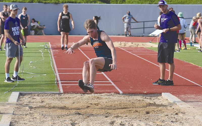 Garrett Heaton takes one of his attempts in the long jump at The Battle of the Blue Ridge at HCHS. Heaton won the event last Friday at the Mt. Yonah Invite.