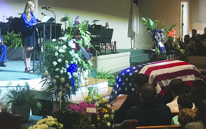 Madison Ball speaks about her love and fond memories of Caleb Griffis on Monday at Level Grove Baptist Church. Caleb died April 1 in a motorcycle accident.