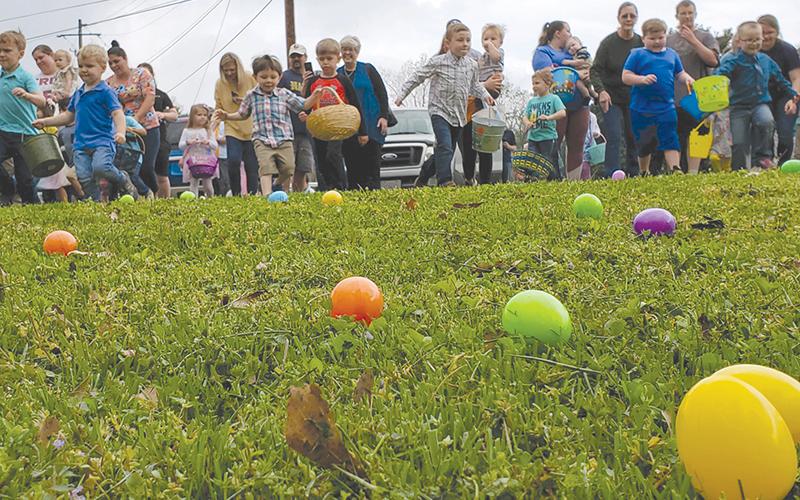 Children attending the egg hunt at the Clarkesville First United Methodist Church get ready to scramble for their multi-colored prizes on Saturday morning. SAMANTHA SINCLAIR/CNI News Service
