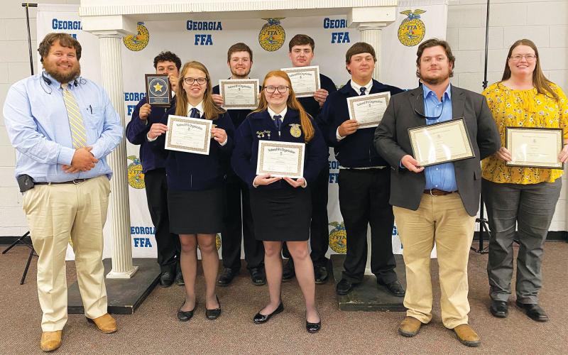 FFA participants from Habersham Central High School included (front row, from left) Advisor Willie Crump, Emma Holland (State Degree), Jayley Crane (State Degree) and Advisors Aaron Newton and Amy Crump. Back row are (from left) Eddie Ojeda (1st Place State, Swine Production Placement Proficiency), Dylan Rice (State Degree), Drew Maney (State Degree) and Adam Caudell (State Degree). LEIGH VINSON/Submitted