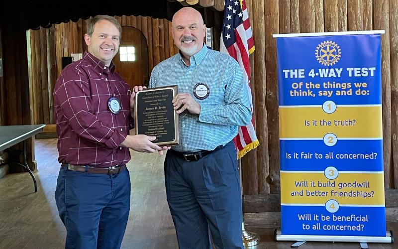 Tim Ash presents James D. Irvin (left) with the Robert S. Stubbs Guardian of Ethics Award. BRIAN WELLMEIER/Staff