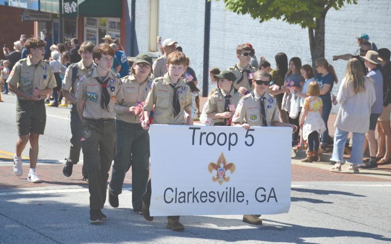 Clarkesville Boy Scout Troop 5 marched in the  parade and later took a dip in the Soque River to retrieve rubber ducks. MATTHEW OSBORNE/Staff
