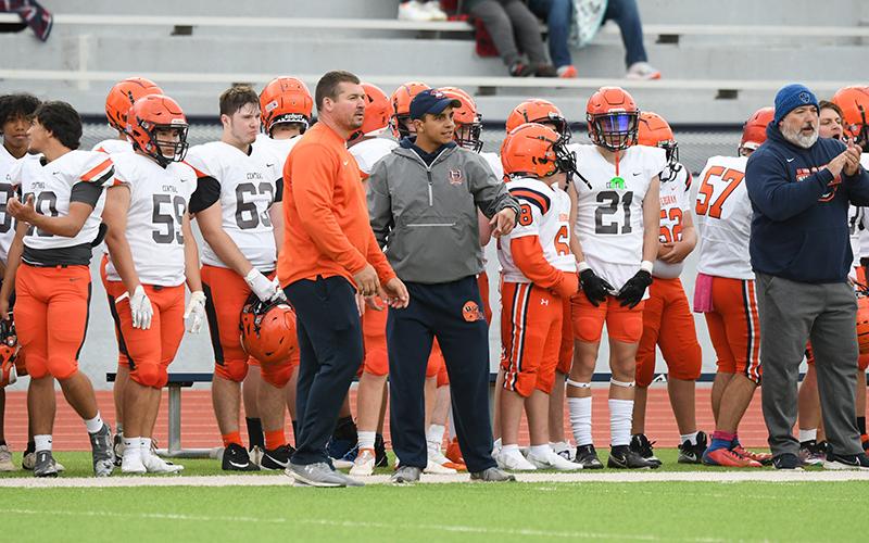 Coaches use the spring game to give hands-on instruction.