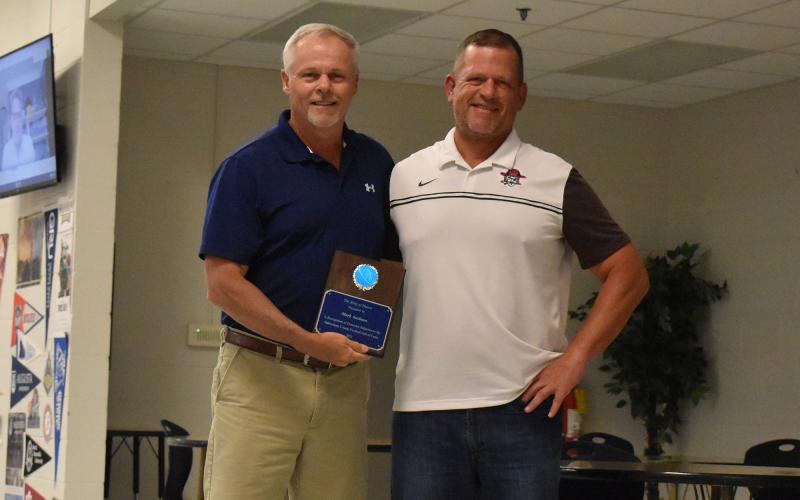 Mark Ausburn (left) was inducted into the Ring of Honor by his longtime friend Walt Poulson (right). ISAIAH SMITH/Staff