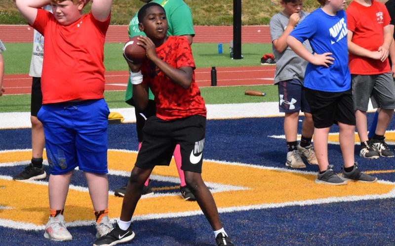 Logan Canada practices his passing for Wednesday’s punt, pass and kick competition. ISAIAH SMITH/Staff