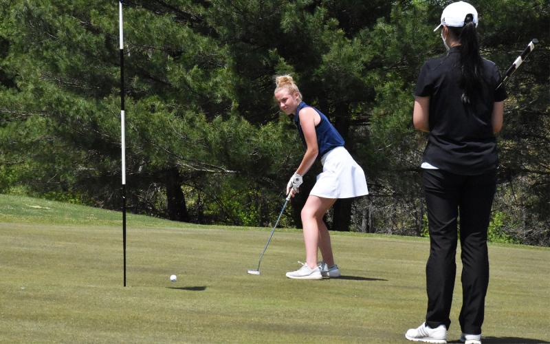 Lauren Nelson watches a putt roll toward the hole during the Area 2-6A tournament April 19. The Lady Raiders won area, and look to put forth a good showing at the state tournament in Carrollton Monday and Tuesday. ISAIAH SMITH/Staff