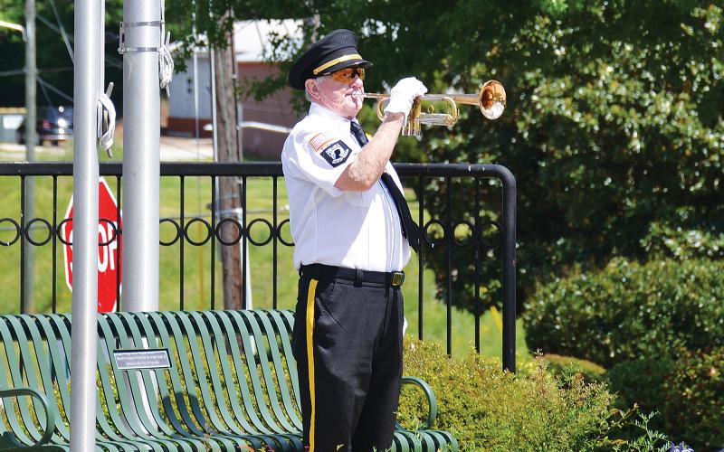 VFW Bugler Danny Stephens plays during the National Day of Prayer recognition in Cornelia on Thursday morning. BRIAN WELLMEIER/Staff