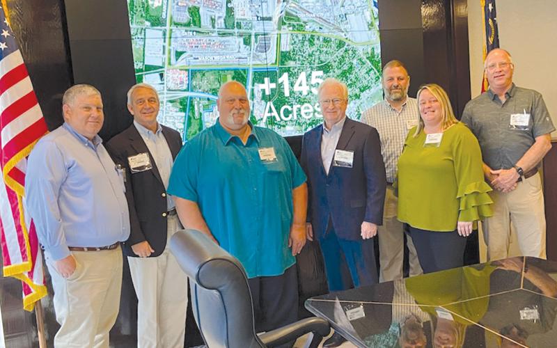 A contingent of Habersham County officials visited the port in Savannah on Friday, including (from left) Habersham County Planning Director Mike Beecham, Partnership Habersham Executive Director Charlie Fiveash, Commissioner Bruce Palmer, County Manager Phil Sutton, Baldwin City Council members Martin and Alice Venter and Georgia Power’s Brent Edwards. SUBMITTED