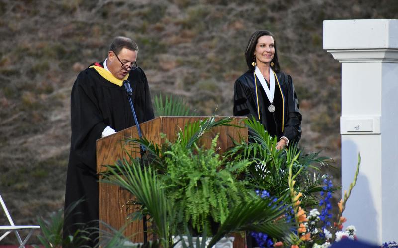 Principal Jonathan Stribling reads the long list of accolades on the resume of Dr. Emily Foster  Howell, the school’s second lifetime achievement award honoree. MATTHEW OSBORNE/Staff