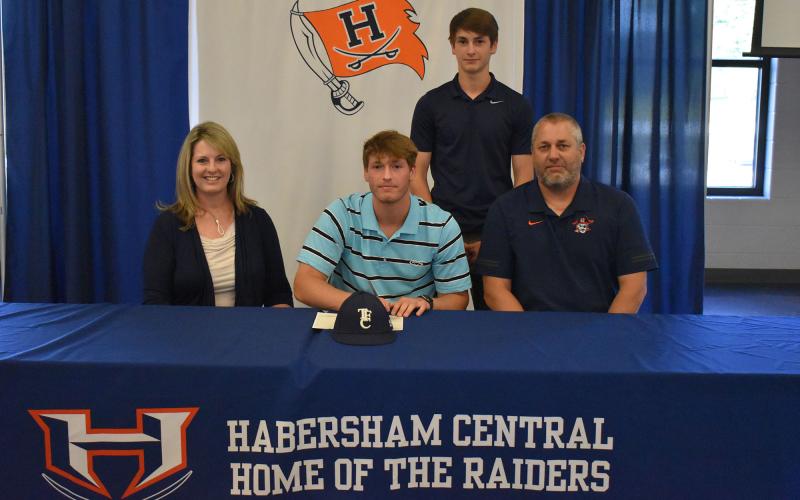 Sutton Dover made his commitment to Covenant College official on Thursday as well. Dover (center) is joined by his mother Kristie Dover (left), father Shane Dover (right) and brother Slade Dover (back).