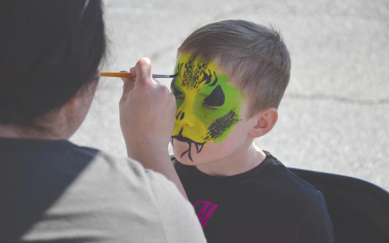 Wyatt Barrs of Cleveland gets his face painted at one of the booths.