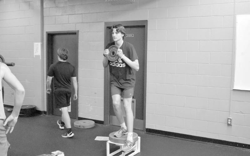 Cooper Smith works on his balance and flexibility during a workout on Thursday. ISAIAH SMITH/Staff