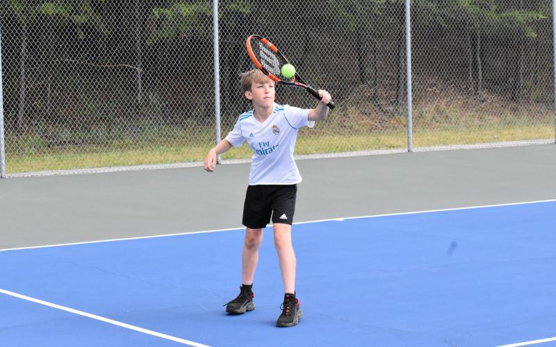 Mason Brautigan works on his backhand during a match. ISAIAH SMITH/Staff