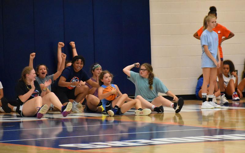 Habersham Central rising senior Nyke Brown shares some fun with some of the participants at Lady Raider basketball camp Wednesday. ISAIAH SMITH/Staff