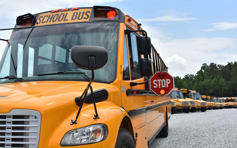 The Habersham County Board of Education is considering a contract with BusPatrol to equip all of its school buses with cameras to deter drivers from passing stopped school buses. Shown are a fleet of buses at the bus shop in Demorest. CHAMIAN CRUZ/Staff
