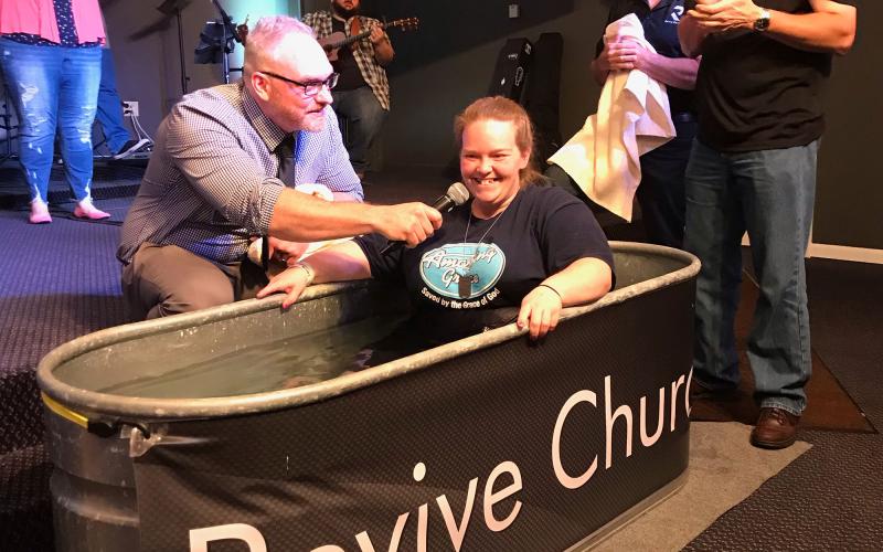 Cassie Kemp says she decided to get baptized after starting her recovery from addiction at Freedom Hill in Demorest. Above, Kemp is baptized at Revive Church. BECKY EASLEY/Submitted