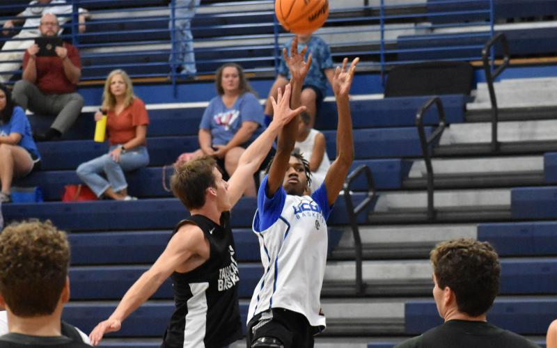 Charlie Cody looks to contest a shot during a summer game last Thursday against Banks County. ISAIAH SMITH/Staff