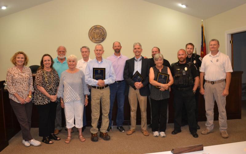 (Front left-right): Council members Roxie Barron, E. Lane Gresham, Mayor Barrie Aycock, Officers Larry Sheffield and Stanley Lovell, Municipal Court Clerk Elaine Waller, Officers Ryan Ledford and Daniel Clouatre. (Back row left-right): Council members Franklin Brown, Terry Gladden, Steven Ward, Police Chief Brad Barrett, and Officer Jamie Bowden. BRIAN WELLMEIER/Staff