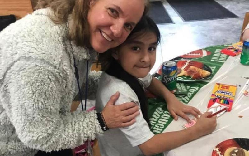 Former Hazel Grove Elementary School Principal Fran Blackburn celebrates Lily Contreras’ student achievement with a pizza party. FRAN BLACKBURN/Submitted